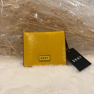 - DKNY Gigi Leather Flat Wallet. Bright Yellow